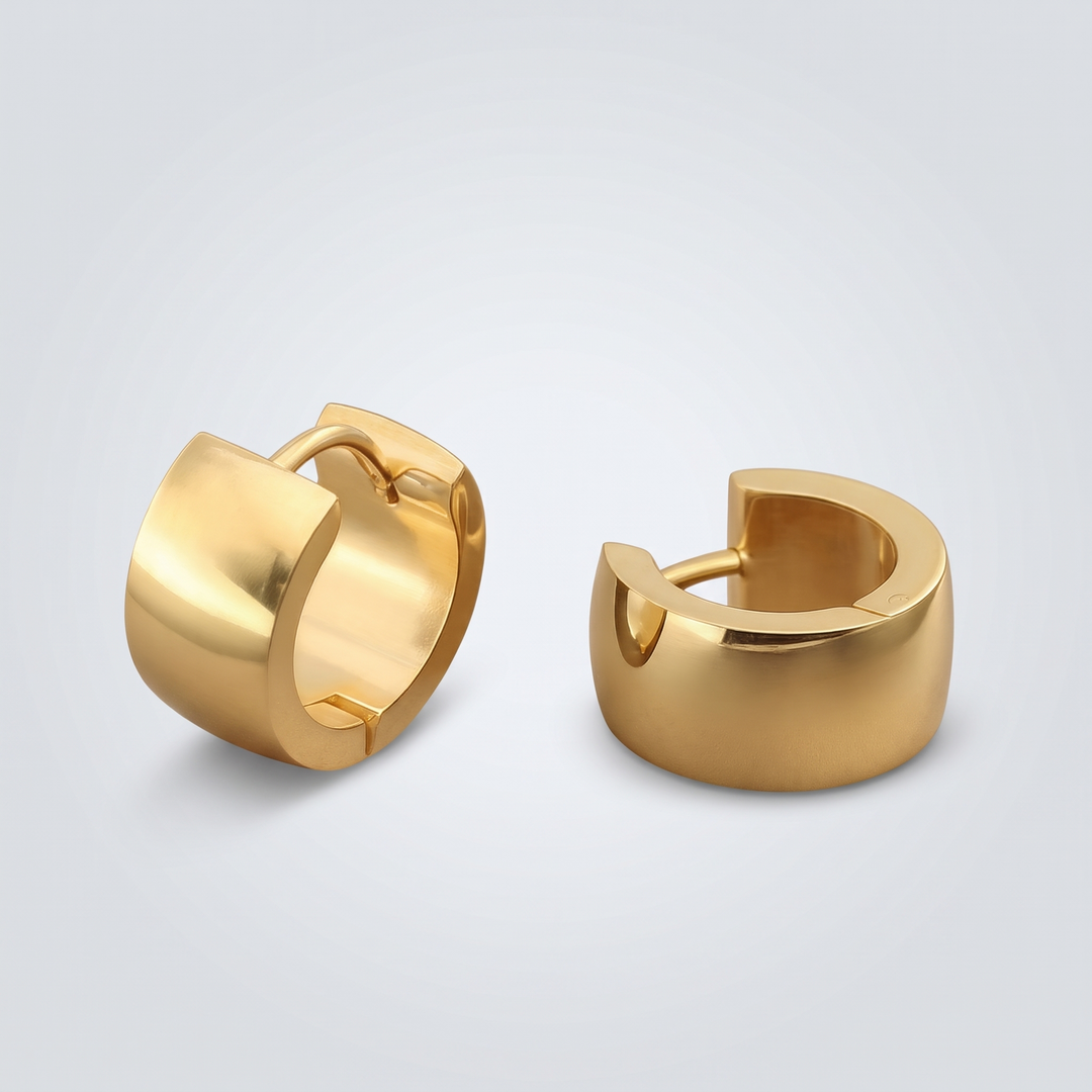 Chunky Huggie Hoops – close-up of the polished wide band and hinged closure, gold-tone