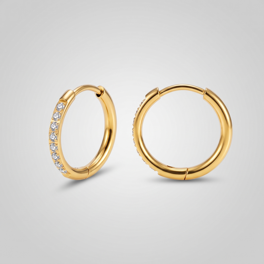 Crystal Huggies in gold-tone, front view of the pair showing the row of clear zirconia stones
