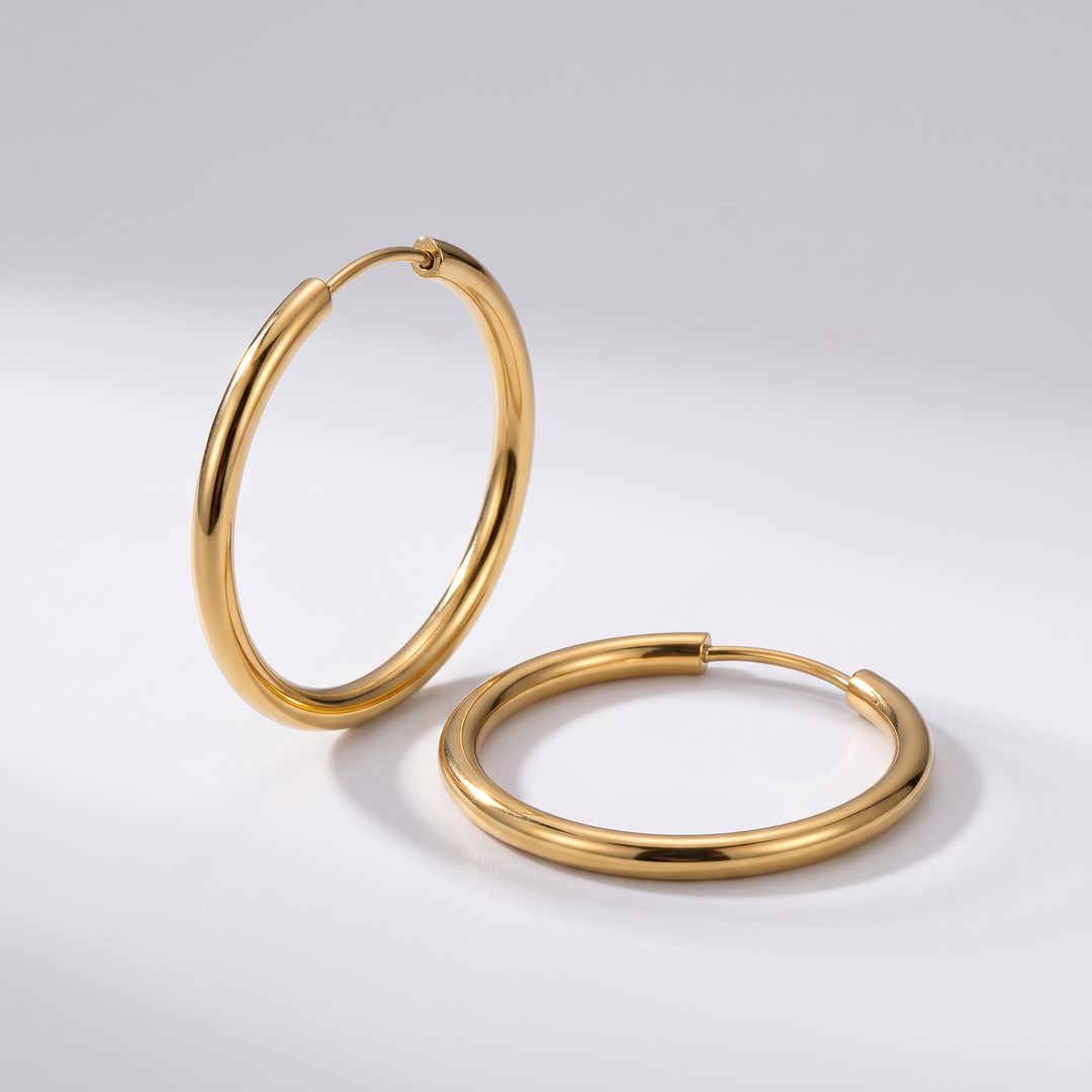 Everyday Hoops: thin gold-tone hoop earrings, angled view showing the slim 2 mm round wire