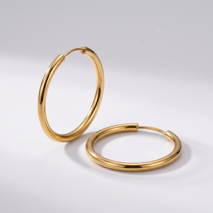 Everyday Hoops: thin gold-tone hoop earrings, angled view showing the slim 2 mm round wire