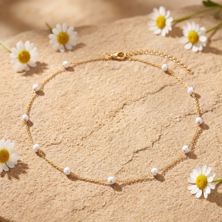 White Enamel Bead Choker on sandstone with daisies