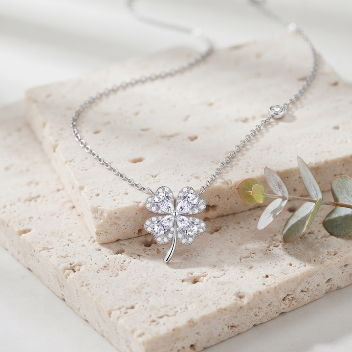 Aurora Clover Necklace on travertine with eucalyptus