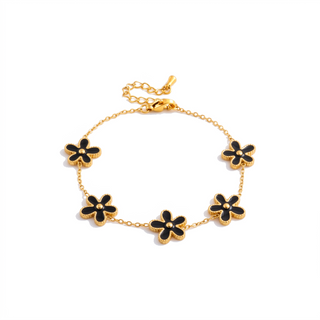 Lucky Petal Bracelet with black enamel petals on white background