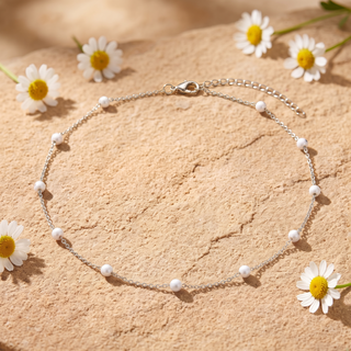 White Enamel Bead Choker in silver on sandstone with daisies