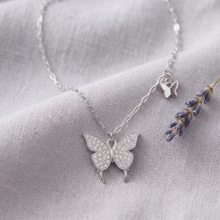 Butteréa Crystal Necklace on grey linen with lavender