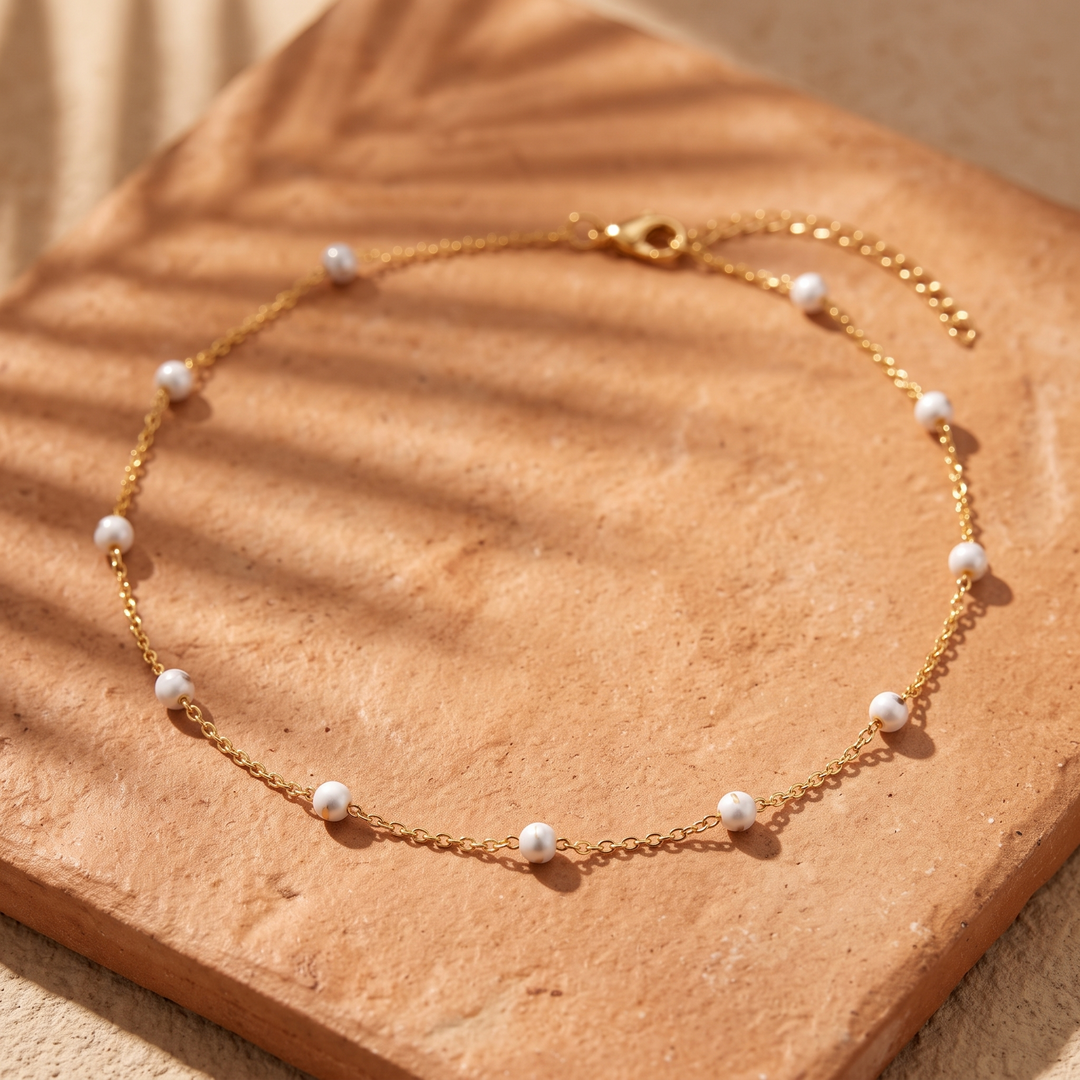 White Enamel Bead Choker on terracotta