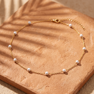 White Enamel Bead Choker on terracotta