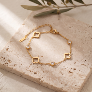 Lumière Clover Bracelet on travertine stone