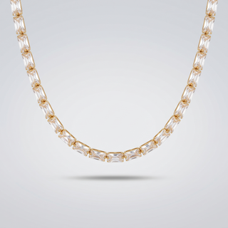 Classic Tennis Necklace curved view showing the single row of clear stones in gold-tone settings