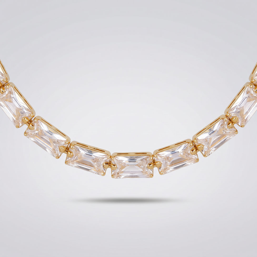 Detail of the clear baguette zirconia stones and gold-tone claw settings of the Classic Tennis Necklace