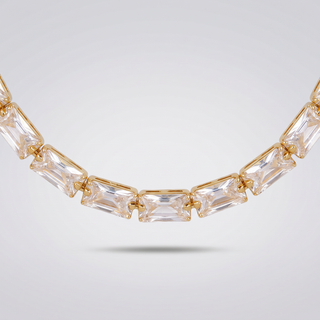 Detail of the clear baguette zirconia stones and gold-tone claw settings of the Classic Tennis Necklace