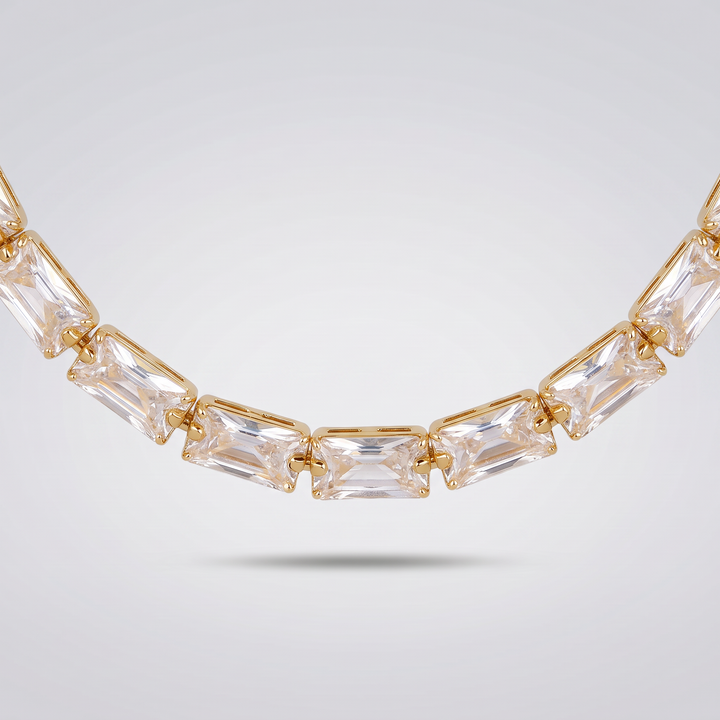 Detail of the clear baguette zirconia stones and gold-tone claw settings of the Classic Tennis Necklace