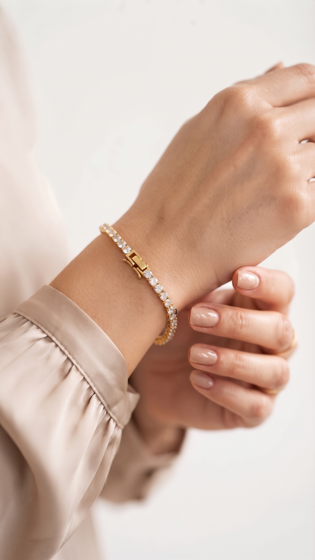 Classic Tennis Bracelet worn on the wrist with a satin blouse