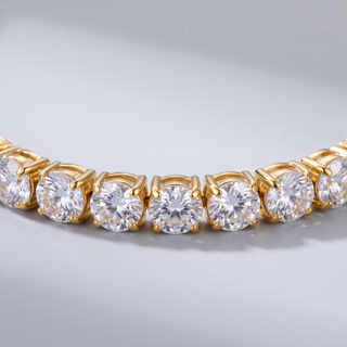 Close-up of the Petite Tennis Bracelet showing the small round clear stones in square gold-tone settings