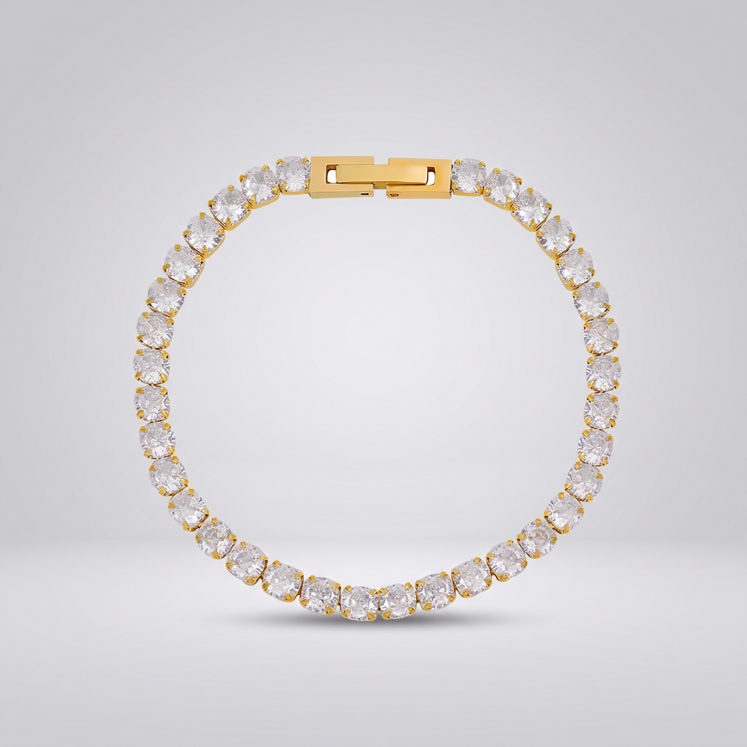 Petite Tennis Bracelet in gold-tone, single row of small round clear stones, flat view on grey studio background