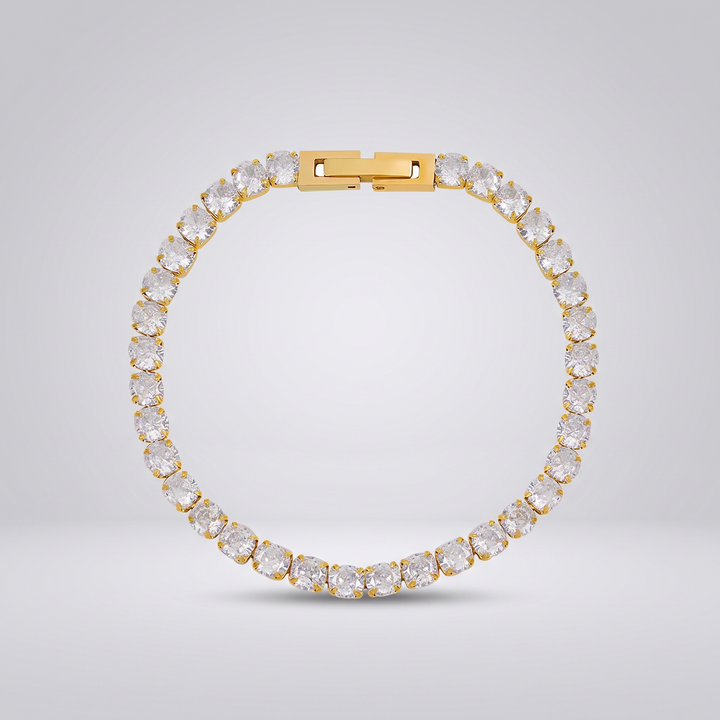 Petite Tennis Bracelet in gold-tone, single row of small round clear stones, flat view on grey studio background