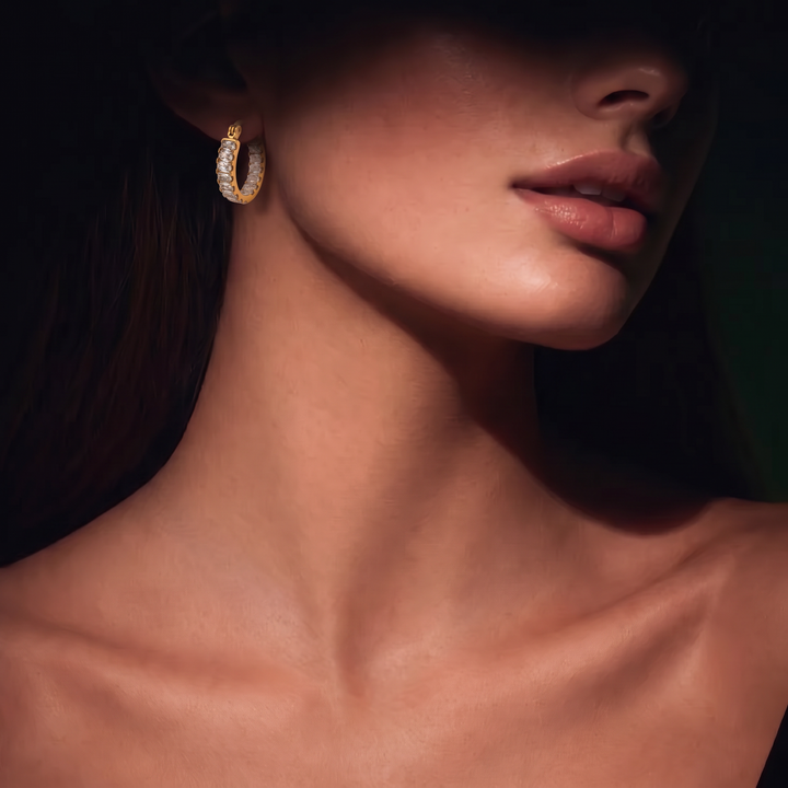 Model wearing the Tennis Huggie Hoops, side view with stones facing the camera