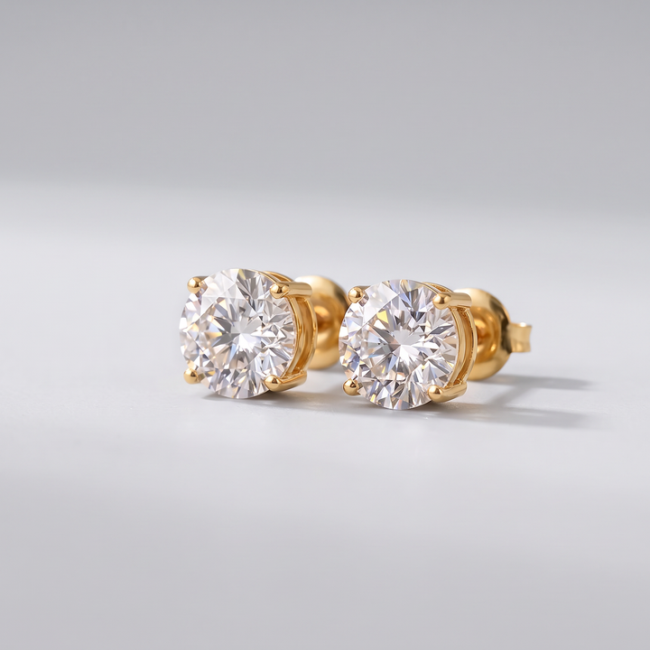 Classic Solitaire Studs in gold-tone, angled view showing the four-prong setting