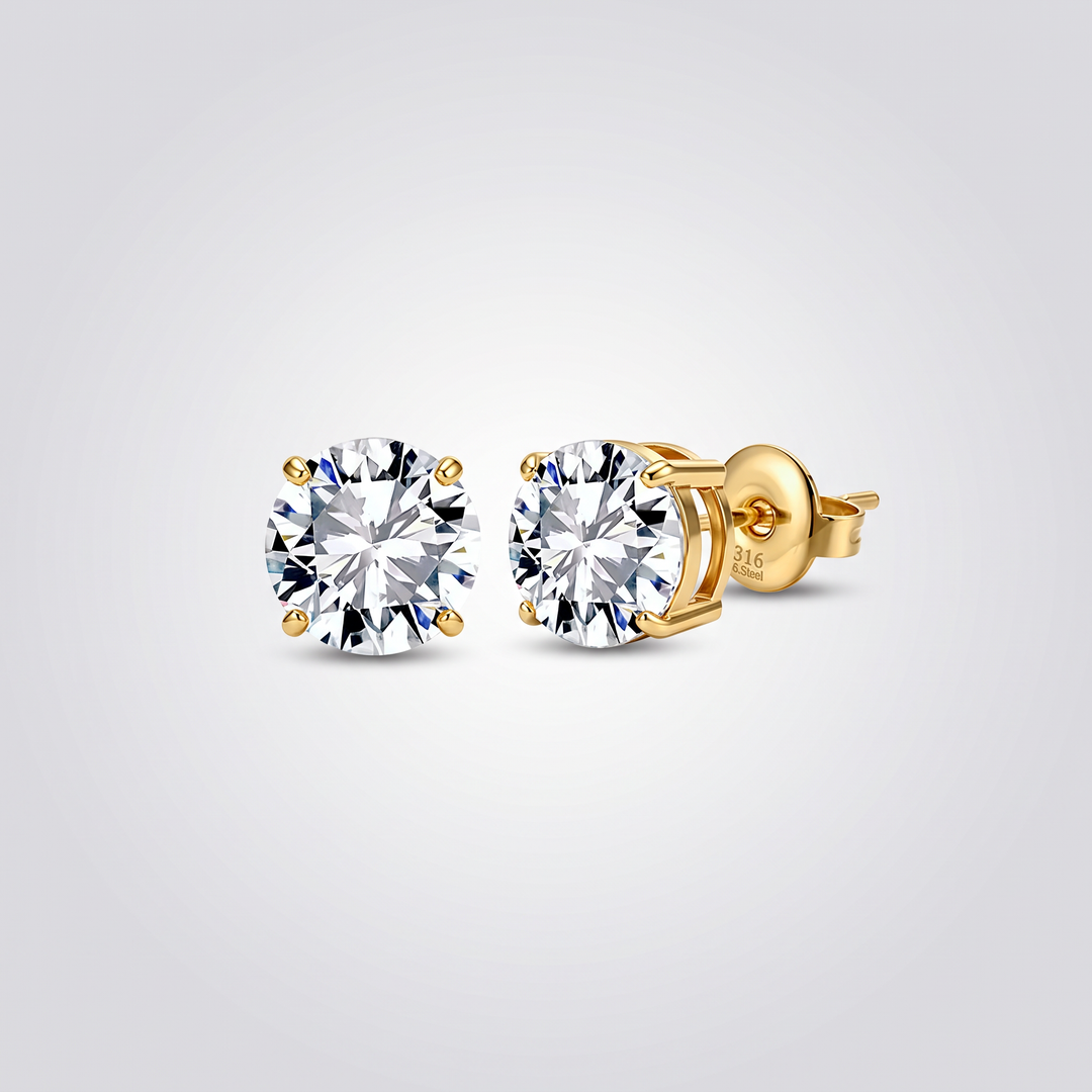 Classic Solitaire Studs in gold-tone, pair of 4-prong round clear zirconia stud earrings on grey studio background
