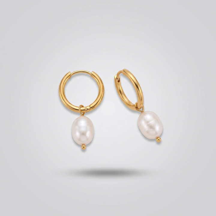 Pearl Drop Huggies in gold: angled view of the pair showing hoop and pearl drop