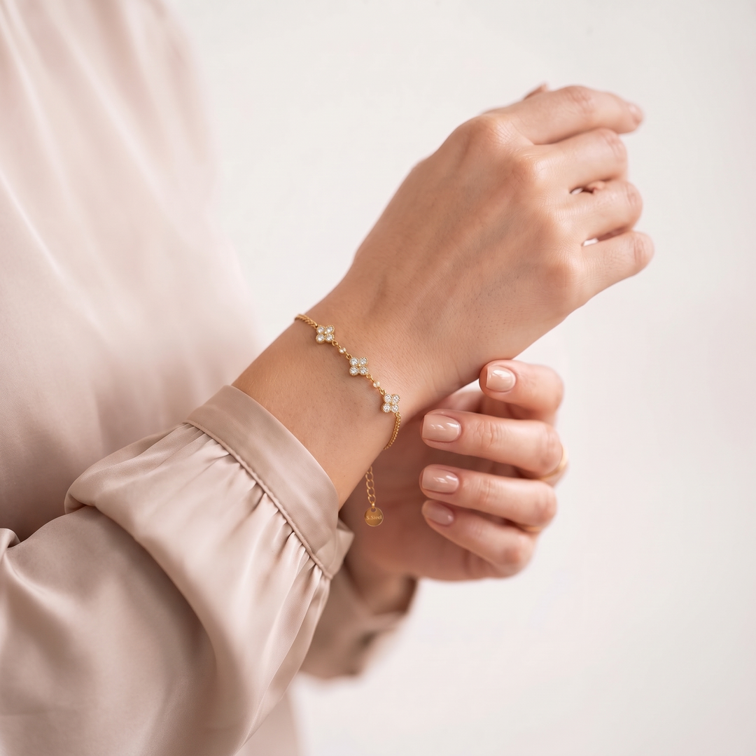 Petite Clover Bracelet worn on the wrist